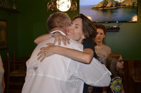 Dawn Wilkerson hugs John Albury on Monday when they met for lunch at Daddy O’Brien’s. Albury, a parademic, rushed to Wilkerson’s aid during an epileptic seizure at the restaurant in July. (CARL MCKINNEY/Lake City Reporter)