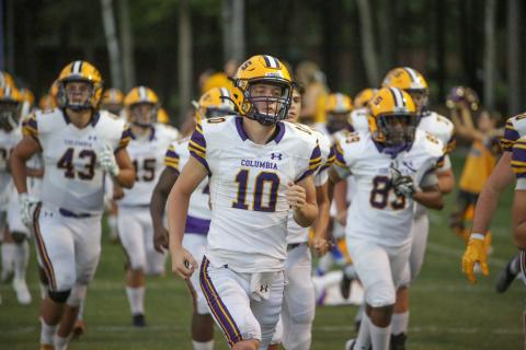 Columbia quarterback Kade Jackson jogs out onto the field prior to Friday’s game against Trinity Christian. (BRENT KUYKENDALL/Lake City Reporter)