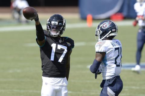 Jacksonville Jaguars wide receiver D.J. Chark (17) signals a first down after a reception against Tennessee Titans cornerback Malcolm Butler (21) on Sunday, in Nashville, Tenn. (MARK ZALESKI/Associated Press)