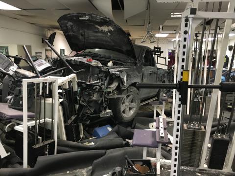 A truck sits in the middle of Branford Fitness and Tanning after ramming into the gym late Monday night. Nobody was injured in the crash. (COURTESY BILL PROCKO)