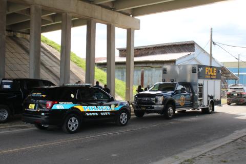 The Florida Department of Law Enforcement’s crime scene technicians helped process the scene on Northwest Railroad Street where a black female body was found Friday morning. (TONY BRITT/Lake City Reporter)