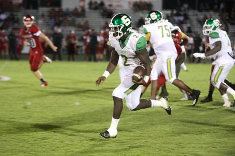 Suwannee quarterback Jaquez Moore scrambles up the field against Hamilton County last Friday. (PAUL BUCHANAN/Special to the Reporter)
