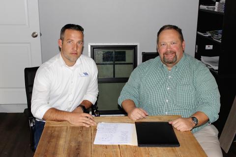 Columbia Builder’s Association President Isaiah Cully (left) and Lake City Reporter Publisher Todd Wilson discuss this year’s Parade of Homes, which is scheduled for the weekend of October 24-25. (BRYAN ZECHER/Special to the Reporter)
