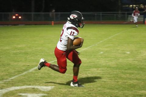 Fort White defensive back Najeeb Smith returns an interception against Santa Fe on Friday night. Smith also caught four passes for 113 yards while playing receiver. (JORDAN KROEGER/Lake City Reporter)
