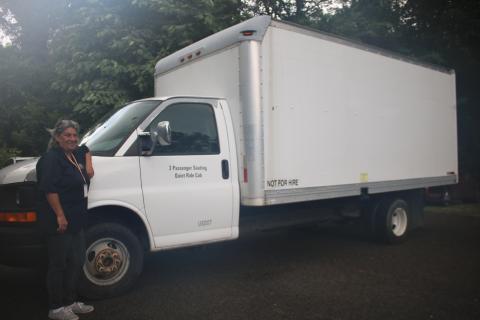 Annette Martin, Lake City-Columbia County Humane Society intake coordinator, stands next to a 2008 GMC box truck that was donated to the agency earlier this week. (TONY BRITT/Lake City Reporter)