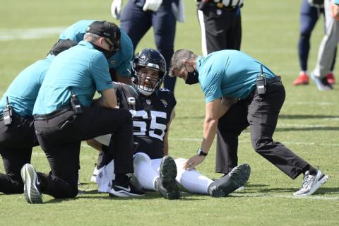 Jacksonville Jaguars center Brandon Linder (65) is helped by medial personnel after being injured against the Tennessee Titans on Sunday, in Nashville, Tenn. (MARK ZALESKI/AP Photo)