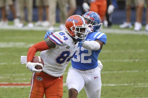 Florida tight end Kyle Pitts (84) breaks away from Mississippi linebacker Jacquez Jones (32) on Saturday, in Oxford, Miss. No. 5 Florida won 51-35. (THOMAS GRANING/Associated Press)