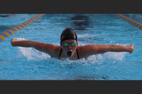 Columbia swimmer Kaydence Clark competes in the 100-yard butterfly during Wednesday’s tri-meet against Saint Francis Catholic and Oak Hall. (SHELBY CONKLIN/Special to the Reporter)