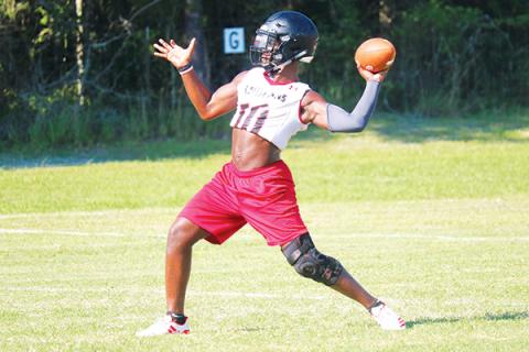 Fort White quarterback Tyler Jefferson throws during practice last season. The Indians will hold their first fall practice on Tuesday. (FILE)