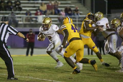 BRENT KUYKENDALL/Lake City Reporter Florida High quarterback Tre Donaldson scrambles up the field as Columbia linebacker Bobby Miller gives chase on Friday. (BRENT KUYKENDALL/Lake City Reporter)