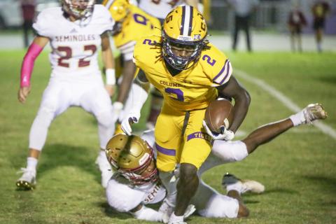 Columbia receiver Jaden Williams escapes a tackle from a Florida High defender last Friday. (BRENT KUYKENDALL/Lake City Reporter)