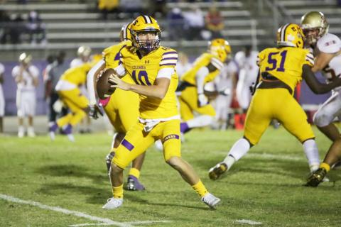 Columbia quarterback Kade Jackson drops back to pass against Florida High on Friday night. (BRENT KUYKENDALL/Lake City Reporter)