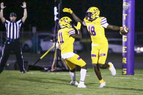 Columbia receiver Marcus Peterson  (18) celebrates with receiver Jaquez Redic (11) after scoring a touchdown against Florida High last Friday. (BRENT KUYKENDALL/Lake City Reporter)