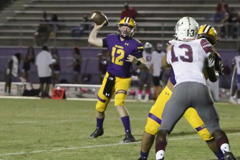 Columbia quarterback Ty Wehinger unloads a pass against Madison County on Friday. (BRENT KUYKENDALL/Lake City Reporter)