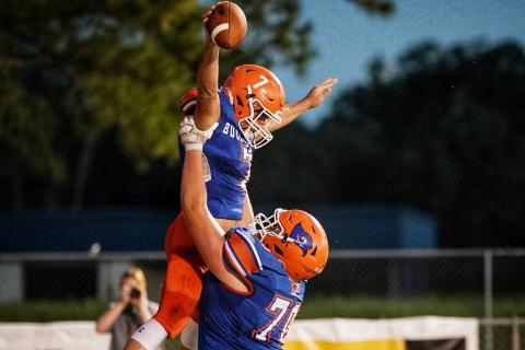 Branford's Bodhi White celebrates his touchdown against Bishop Snyder with offensive lineman Colton Allen on Sept. 25. (BRIAN LEWIS/Special to the Reporter)