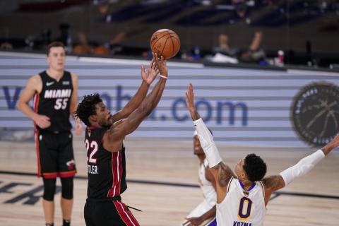 Miami Heat's Jimmy Butler (22) shoots against Los Angeles Lakers' Kyle Kuzma (0) during the second half in Game 3 the NBA Finals on Sunday, in Lake Buena Vista. (MARK  J. TERRILL/Associated Press)