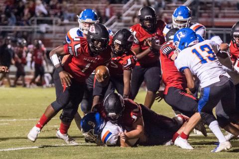 Fort White quarterback Tyler Jefferson looks for running room against Taylor County on Friday. (CHRISTINA FEAGIN/Special to the Reporter)