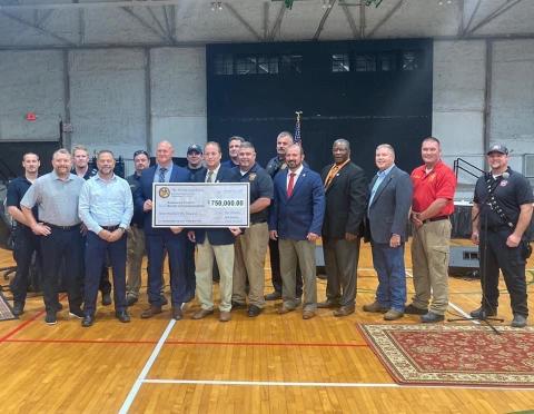 Suwannee County officials with state legislators Chuck Brannan and Rob Bradley after receiving a check for $750,000 in state appropriations for a new fire station. (COURTESY Suwannee County Fire Rescue)