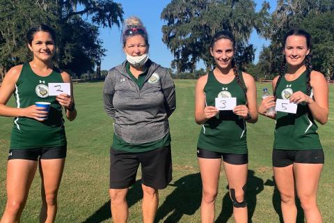 Merlin Leal (second place), Savana Thomas (third) and Amber Hollingsworth (fifth) all placed in the top five at the Tallahassee Community College Open on Saturday. Pictured are Leal (from left), FGC coach April Morse, Thomas and Hollingsworth. (COURTESY)