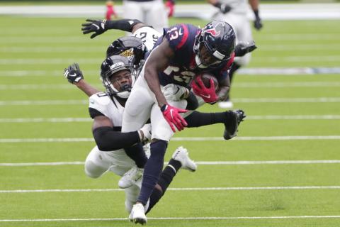 Houston Texans wide receiver Brandin Cooks (13) is hit by Jacksonville Jaguars safety Daniel Thomas (20) after a catch on Oct. 11, in Houston. (MICHAEL WYKE/Associated Press)