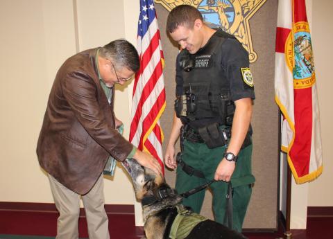 Columbia County Sheriff Mark Hunter thanks K9 officer Rek for his six years of service with the sheriff’s office. Rek was retired Monday and adopted by his handler/partner, Deputy Matthew Waddington. (COURTESY Columbia County Sheriff's Office)