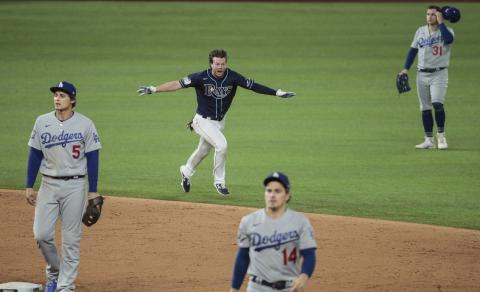 The Tampa Bay Rays' Brett Phillips celebrates his game-winning two-run single against the Los Angels Dodgers in Game 4 of the World Series at Globe Life Field on Saturday in Arlington, Texas. The Rays won 8-7 to even the series. (ROBERT GAUTHIER/Los Angeles Times/TNS)