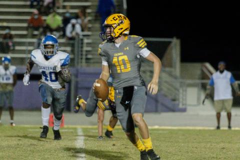 Columbia quarterback Kade Jackson looks to pass against Lee on Friday night. (RAY CARPENTER PHOTOGRAPHY)