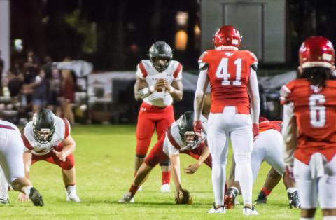 Fort White quarterback Tyler Jefferson gets set to take a snap against Santa Fe on Sept. 18. (CHRISTINA FEAGIN/Special to the Reporter)