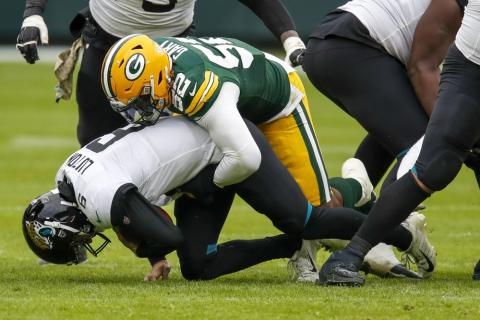 Jacksonville Jaguars' Jake Luton is sacked by Green Bay Packers' Rashan Gary Sunday in Green Bay, Wis. The Packers won 24-20. (MATT LUDTKE/Associated Press)