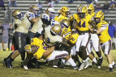 Columbia defensive lineman Nate Walmsley tackles Daytona Beach Mainland quarterback Theodore Lockley during Friday’s Region 1-6A semifinal. (BRENT KUYKENDALL/Lake City Reporter)