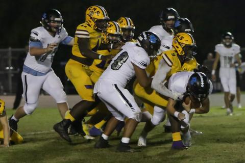 Columbia defensive lineman D.J. Bennett (9) makes a tackle against Ponte Vedra during Friday’s Region 1-6A playoff game. (BRENT KUYKENDALL/Lake City Reporter)