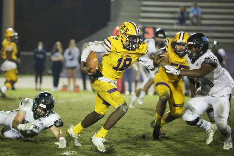 Columbia quarterback Marcus Peterson scrambles up the field against Ponte Vedra during last Friday's Region 1-6A playoff game. (BRENT KUYKENDALL/Lake City Reporter)