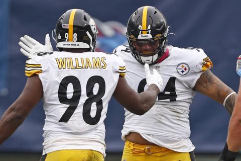 Pittsburgh Steelers inside linebacker Vince Williams (98) celebrates with nose tackle Tyson Alualu (94) after Williams sacked Tennessee Titans quarterback Ryan Tannehill (17) on Oct. 25 in Nashville, Tenn. (WADE PAYNE/Associated Press)