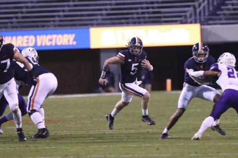 Virginia quarterback Brennan Armstrong (5) runs the ball against Abilene Christian on Nov. 21 in Charlottesville, Va. (ERIN EDGERTON/The Daily Progress via AP)