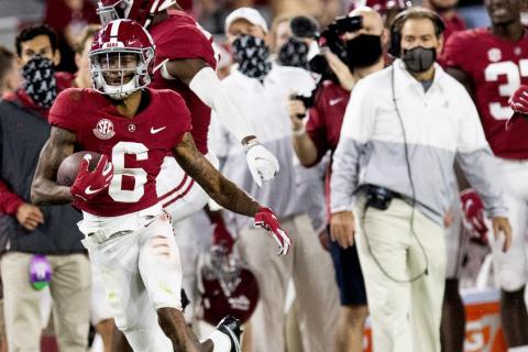 Alabama wide receiver DeVonta Smith (6) heads for a long gain as coach Nick Saban watches during a game against Kentucky on Nov. 21 in Tuscaloosa, Ala. (MICKEY WELSH/The Montgomery Advertiser via AP)