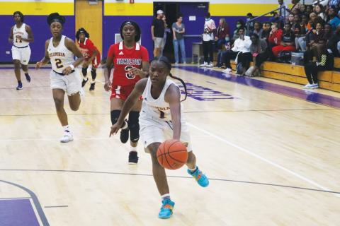 Columbia guard Anzarria Jerkins chases down a loose ball for a steal and layup against Hamilton County during Tuesday’s preseason game. (JORDAN KROEGER/Lake City Reporter)