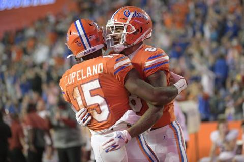 Florida wide receiver Jacob Copeland (15) is congratulated by wide receiver Trevon Grimes (8) after catching a pass for a 33-yard touchdown against Arkansas on Nov. 14 in Gainesville. (PHELAN M. EENHACK/Associated Press)