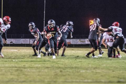 Fort White running back Tavion Taylor hits the hole on a carry up the middle against Hamilton County last Friday. (CHRISTINA FEAGIN/Special to the Reporter)