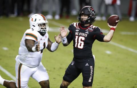 North Carolina State quarterback Bailey Hockman (16) prepares to pass while pressured by Miami defensive lineman Nesta Jade Silvera (1) on Nov. 6 in Raleigh, N.C. (ETHAN HYMAN/The News & Observer via AP, Pool)