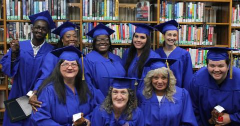 Graduating with their diploma in 2019 through the library’s program were Carrie Murphy (front row, from left), Kitty Dawson, Edith Daniel-Crown, Sheldon Taylor; and Darius Turner (back row, from left), Antrice Byrd, Melissa Perry, Jessica Blake and Deanna Bosket. (COURTESY)