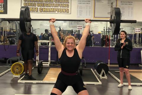 Columbia’s Reece Chasteen finishes her clean and jerk during Tuesday’s meet against Fort White. She won the 183-pound weight class. (JEN CHASTEEN/Special to the Reporter)