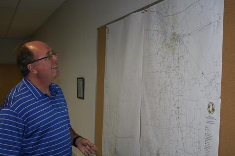 Shayne Morgan, Columbia County Emergency Management director, looks at a county map Monday afternoon in the county Emergency Operations Center as he begins to prepare for the possibility of Tropical Storm Eta impacting Columbia County. (TONY BRITT/Lake City Reporter)