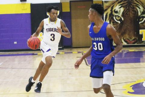 Columbia forward Charleston Ponds pushes the ball up the floor against Wildwood during Tuesday’s preseason game. (JORDAN KROEGER/Lake City Reporter)