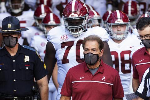 Alabama coach Nick Saban leads his team to the field before a against Missouri on Sept. 26 in Columbia, Mo. Alabama is No. 1 in The Associated Press college football poll for the first time this year, extending its record of consecutive seasons with at least one week on top of the rankings to 13. (AP FILE PHOTO)