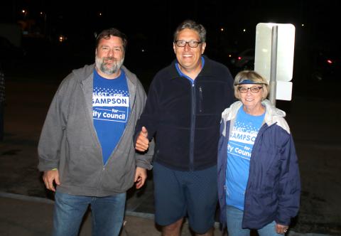 Todd Sampson (center) stands with supporters after he was elected to city council District 13 seat by less than 40 votes Tuesday night. (TONY BRITT/Lake City Reporter)