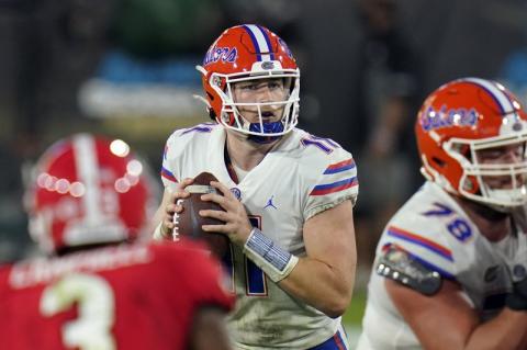 Florida quarterback Kyle Trask (11) looks for a receiver against Georgia on Saturday in Jacksonville. (JOHN RAOUX/Associated Press)