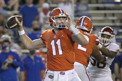 Florida quarterback Kyle Trask (11) looks to throw a pass against Arkansas in Saturday in Gainesville. (PHELAN M. EBENHACK/Associated Press)