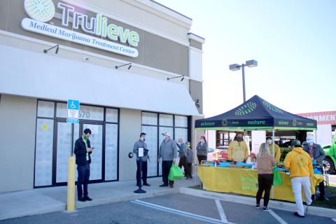 Trulieve Medical Marijuana Treatment Center customers and employees congregate around the center Wednesday morning during the facility’s grand opening. Trulieve is the first medical marijuana dispensary to open in Columbia County. (TONY BRITT/Lake City Reporter)
