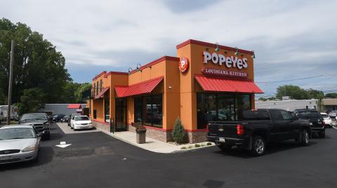 A line of cars forms for the drive-through at a Popeyes in Millcreek, Pa., on the restaurant’s opening day in July 2018. There are plans for a Popeyes to open in Live Oak on U.S. Hwy. 129 N. (JACK HANRAHAN/Erie Times News/TNS)