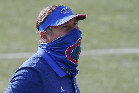 Florida head coach Dan Mullen watches his team warm up prior to a game against Vanderbilt on Nov. 21 in Nashville, Tennessee.  (FREDERICK BREEDON/Getty Images/TNS)